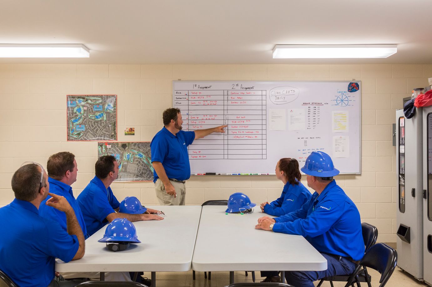 golf course superintendent leading staff meeting for crew